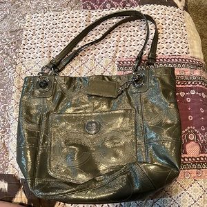 Olive green coach patent leather pocketbook.